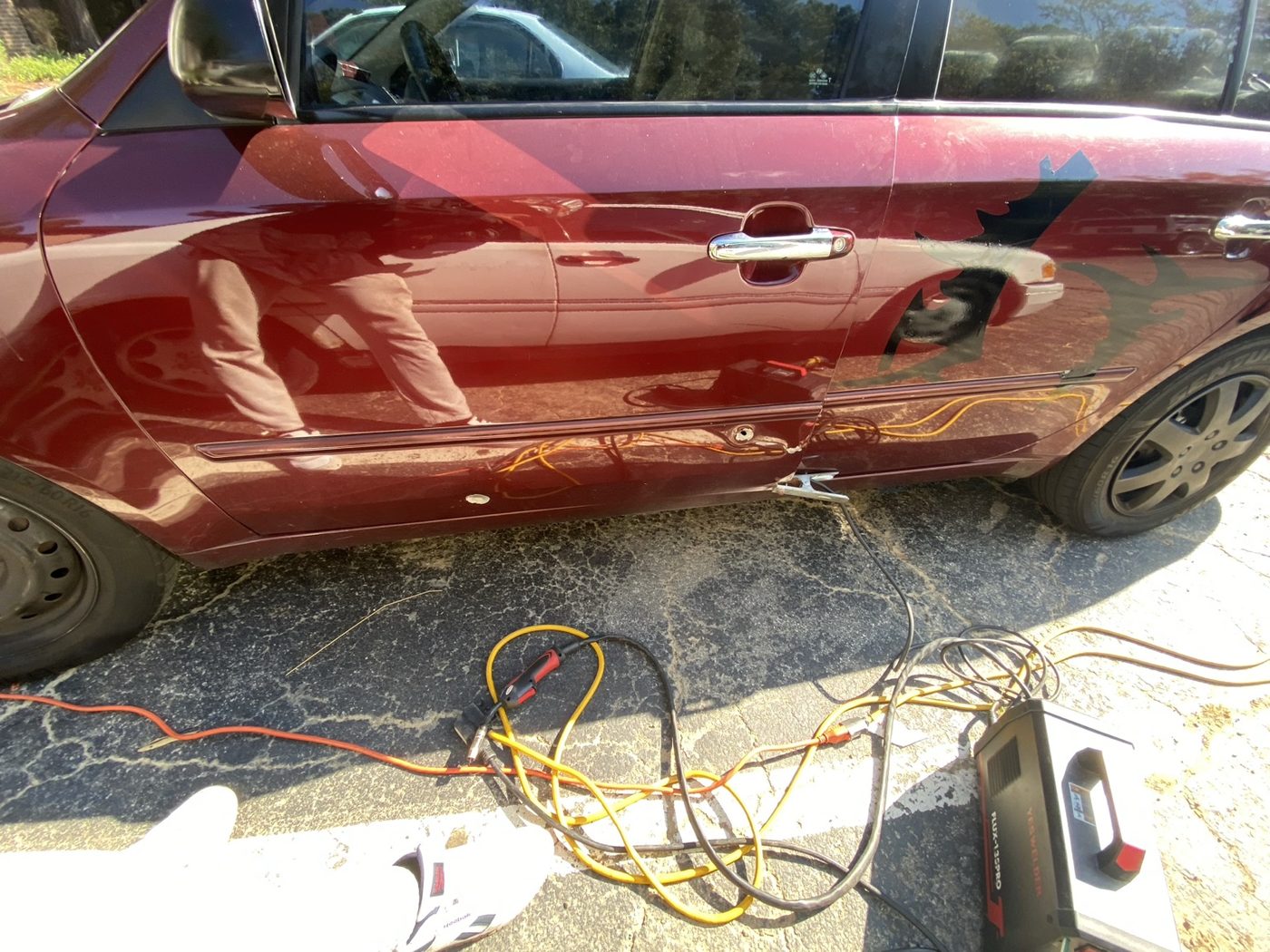 Automotive Bullet Hole Repair — before repair